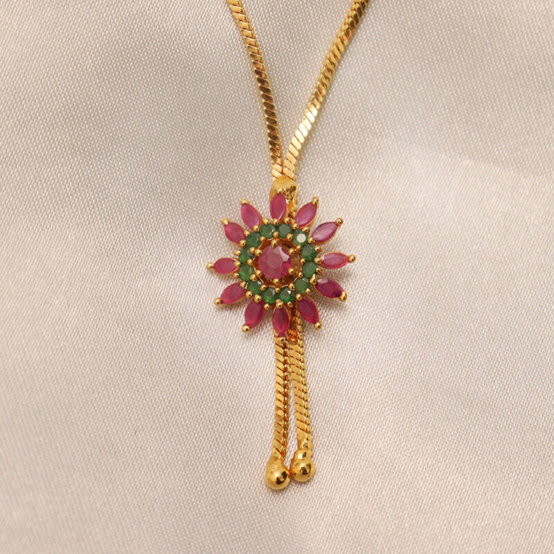 Gold-plated Dollar with Ruby and Emerald Stones